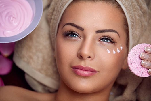 Woman with her face up getting a facial.