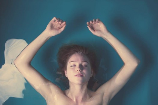 Woman floating in saltwater